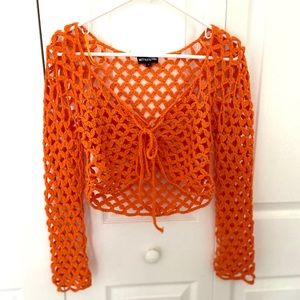 Bright orange crochet long sleeve crop top